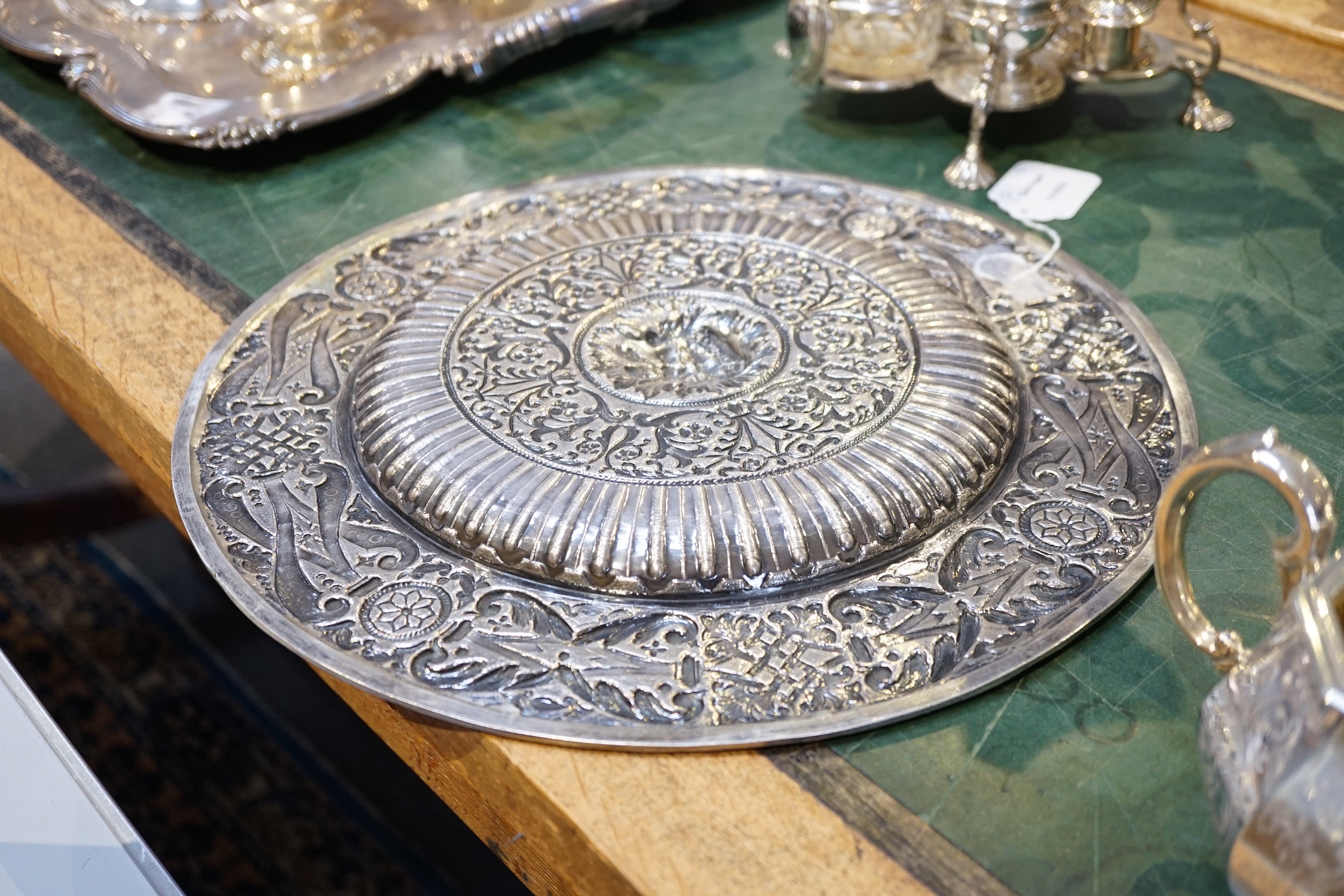 A 20th century Portuguese/Spanish embossed silver charger